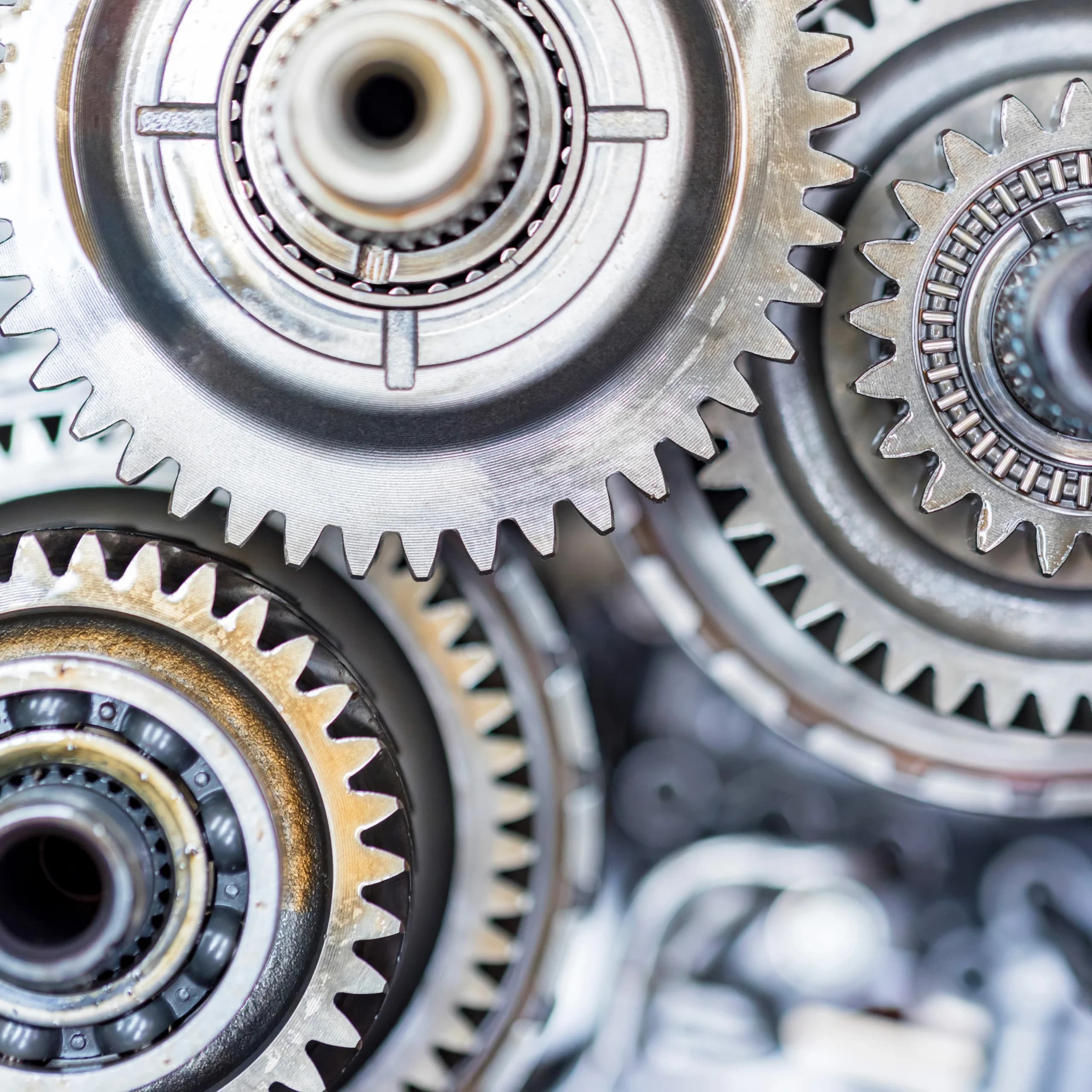 Interlocking metal gears viewed at close range