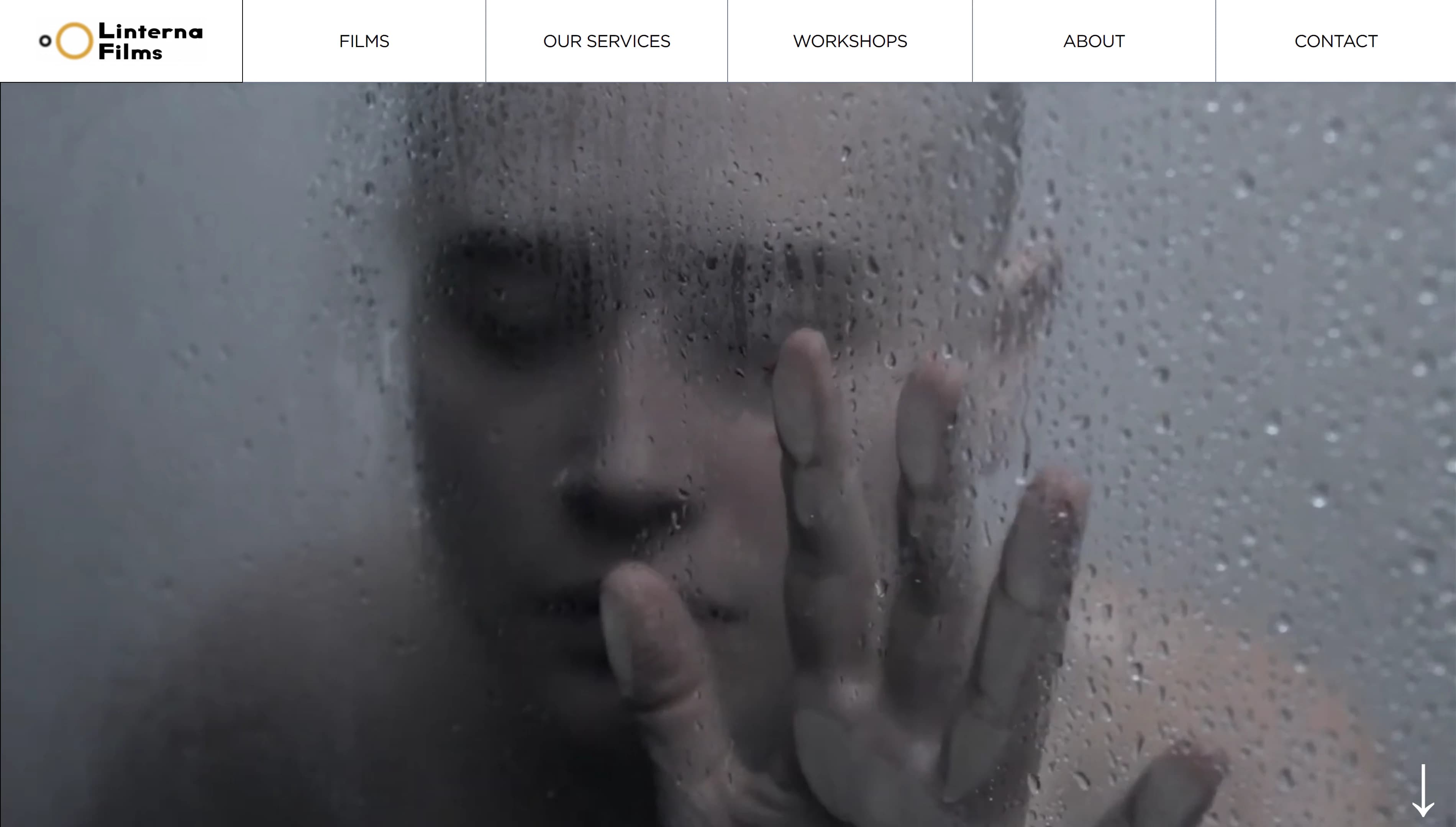 Linterna Films website homepage with a cinematic figure behind rain-covered glass
